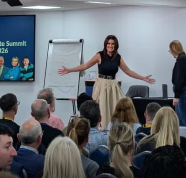 Andrea Cooper on stage in front of an audience at Progressive Property, Peterborough